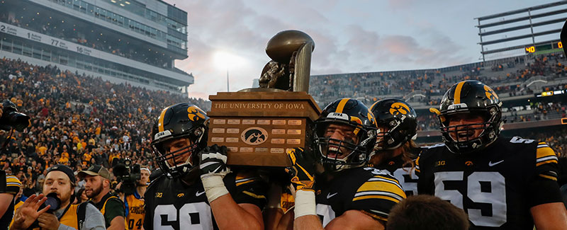 Cy-Hawk trophy held up by players