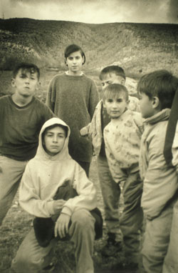 While assisting refugees during the Yugoslav Wars, Iowa City native Amy Weismann helped organize activities such as soccer, gardening, and photography classes. One of the children learning photography took this picture of his friends and fellow Bosnian refugees in the city of Mostar.