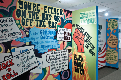 Colorful mural paintings celebrate the mantras and memorable quotes of a generation.