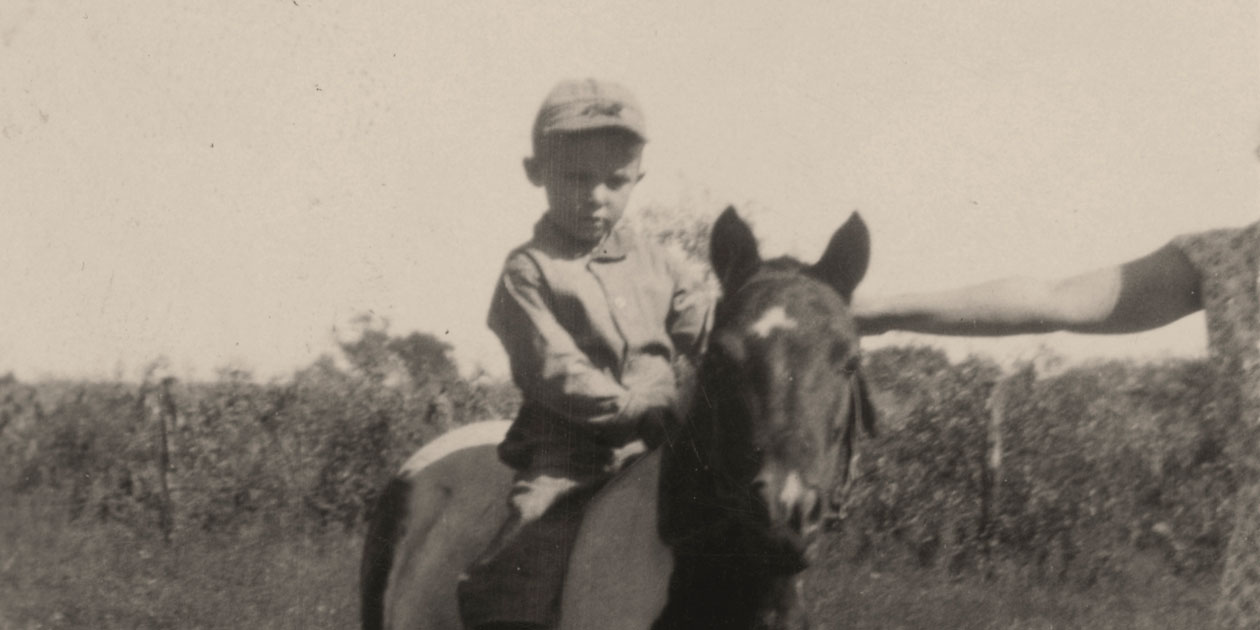 Young Jim Hatch on a horse