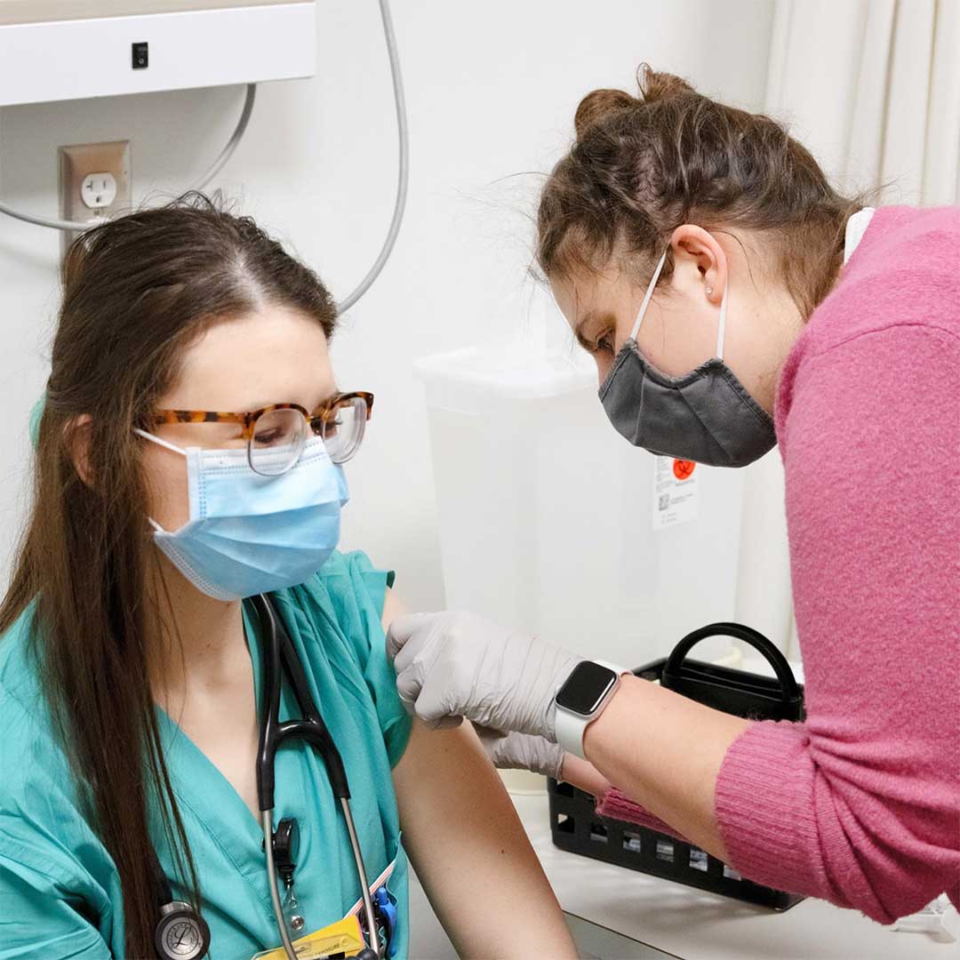 Pharmacy Student Gives Vaccination