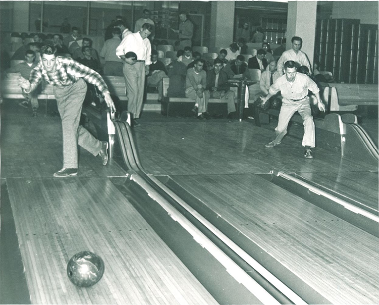 Men bowl in the Iowa Memorial Union