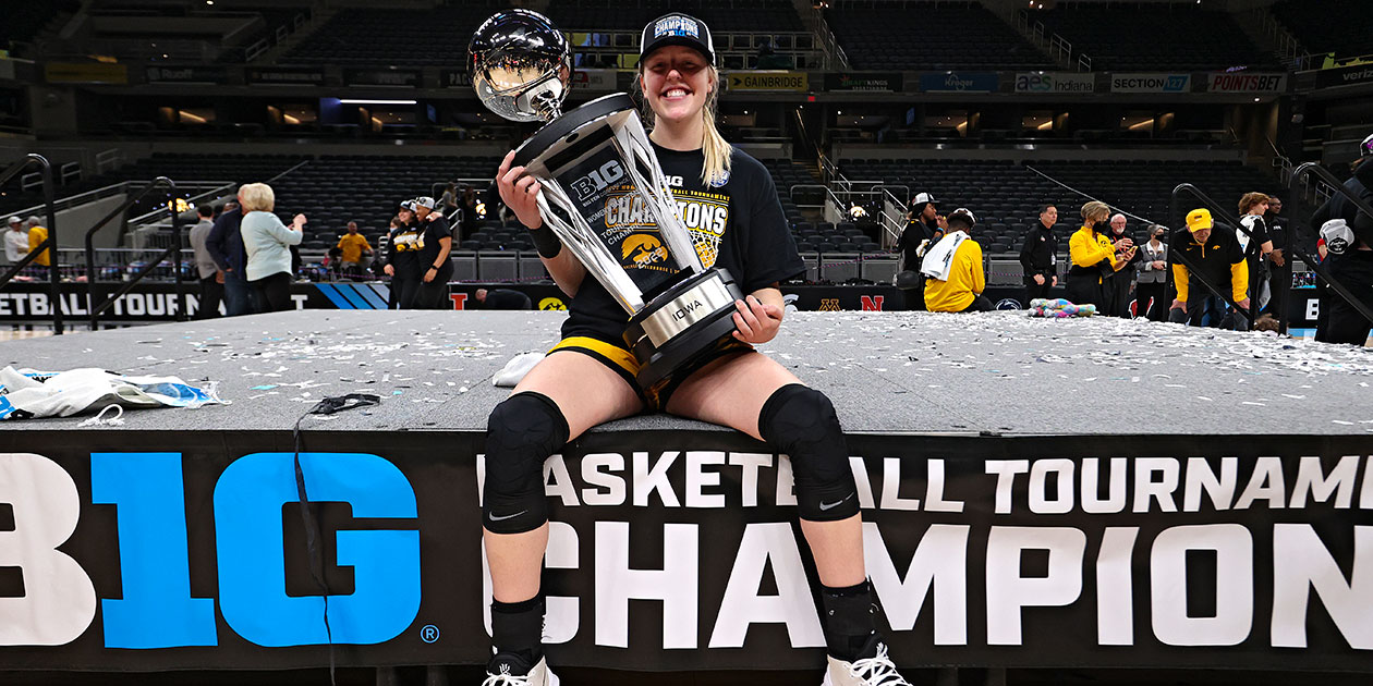 Monika Czinano holding Big Ten Championship Trophy