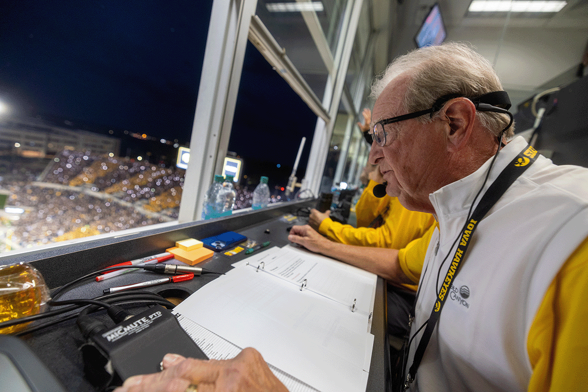 Mark Abbott watching the game from booth