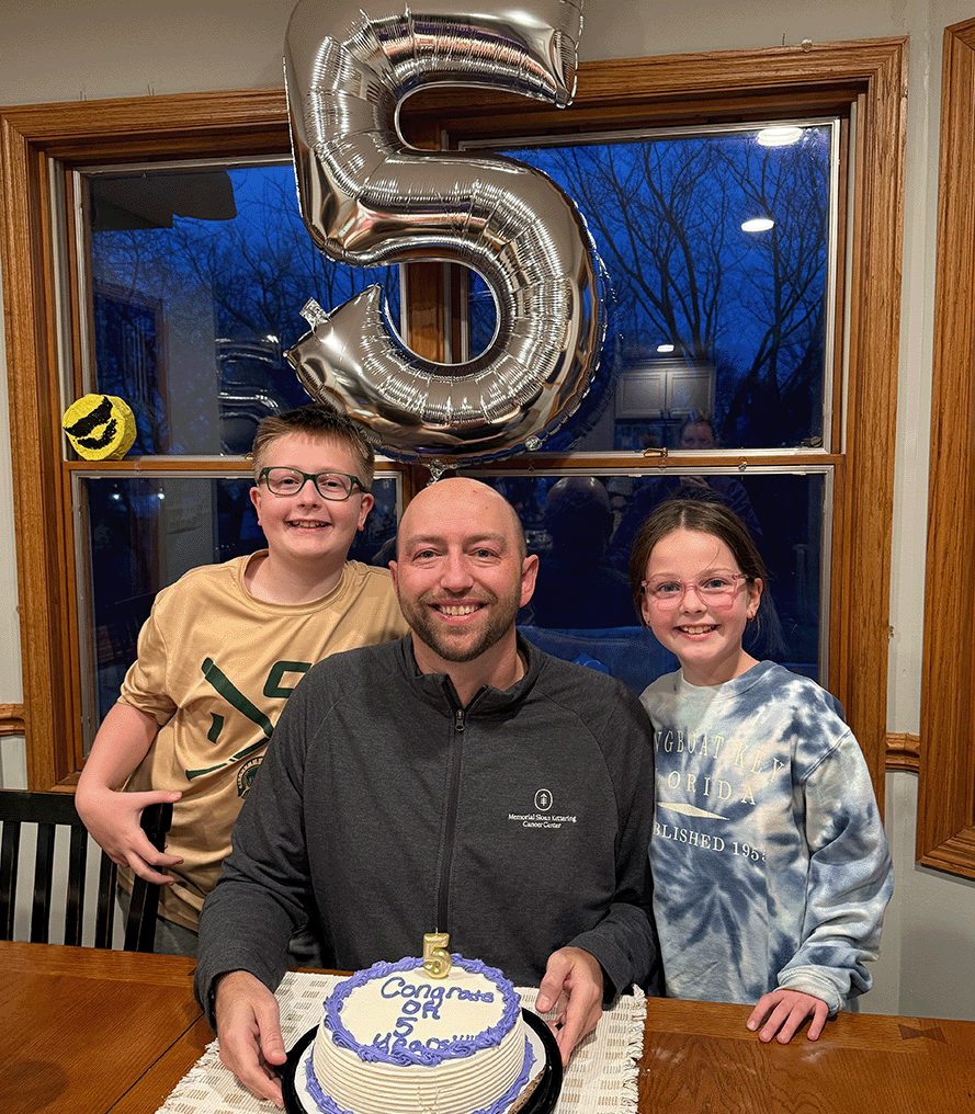 Ryan five-year survivor cake with kids