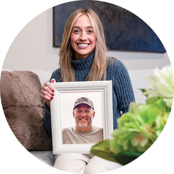 Bailey VandeLune and a photo of her late father