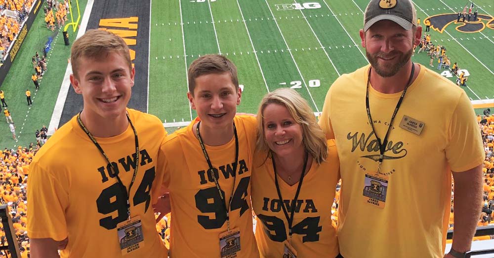 DeVries family at a football game at Kinnick