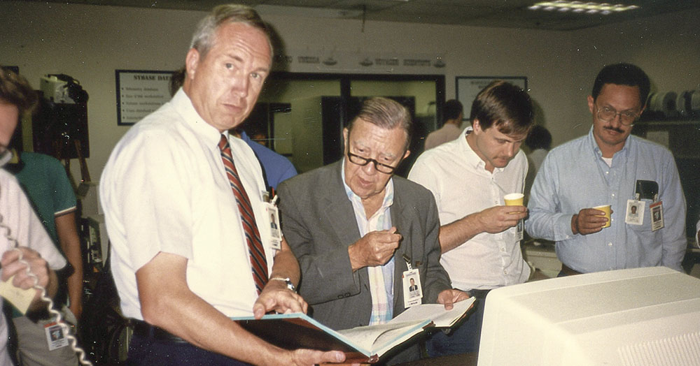 From left, University of Iowa scientists Don Gurnett, James Van Allen, Iver Cairns, and Dave Barbosa study Voyager's 1989 Neptune flyby.