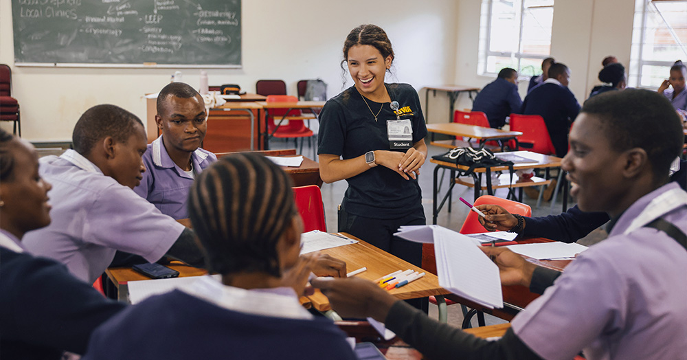 Aubrey Baylor (24BSN) presents a community health workshop to nursing students and occupational health students at Good Shepherd Catholic College of Health Sciences in Siteki, Eswatini, in spring 2024.